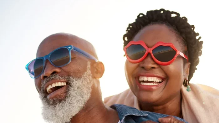 a man and woman wearing sunglasses smiling at The Hudson Oaks