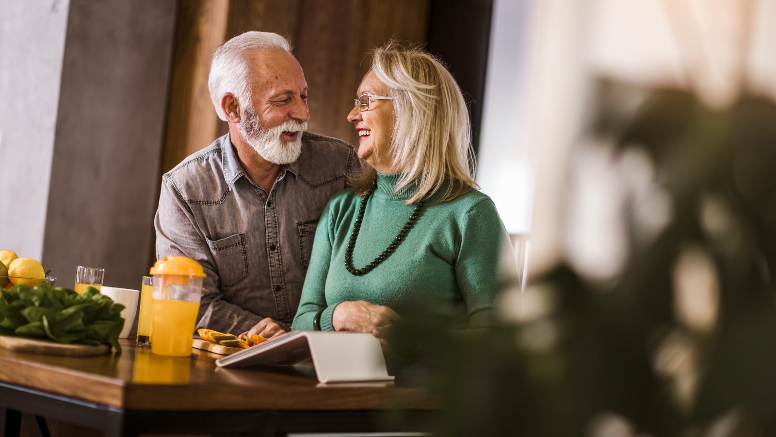 an older couple sitting at a table with food at The Hudson Oaks